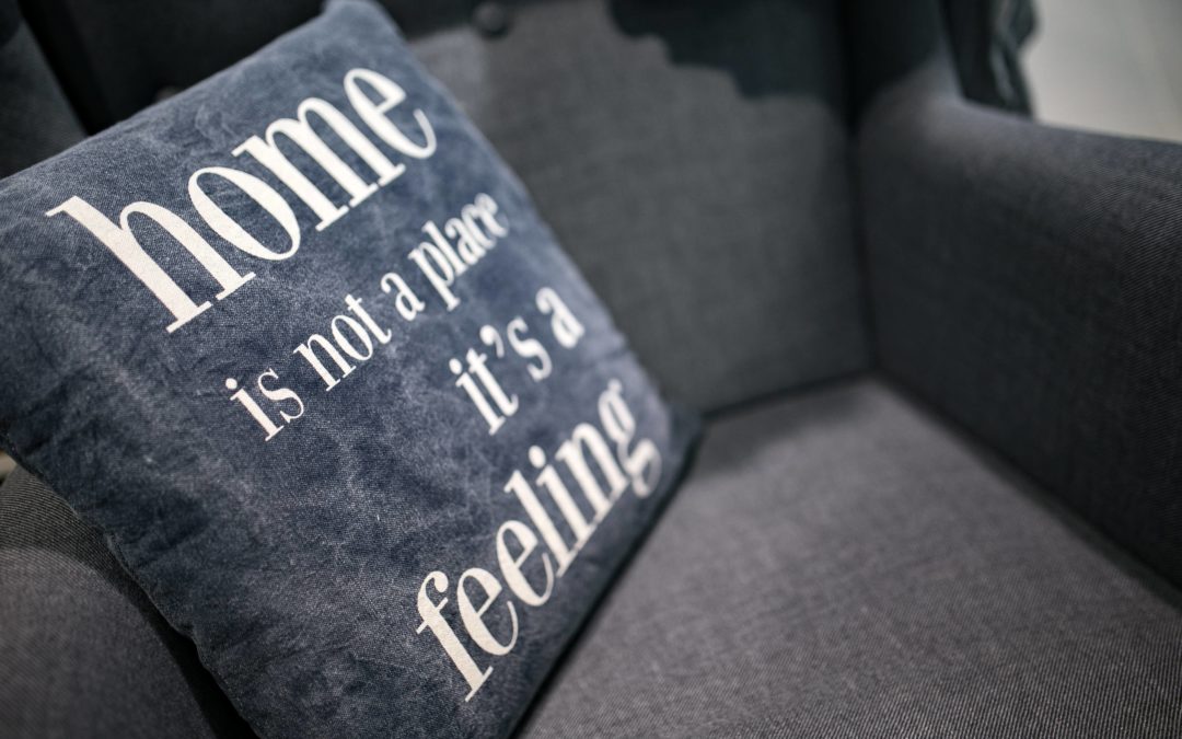 home is not a place it's a feeling cushion on couch